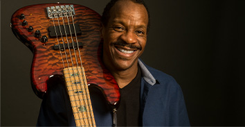 artist, Tony Hall, holding Spector electric bass