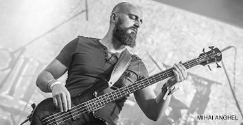 Sean Pollacco playing electric bass in concert