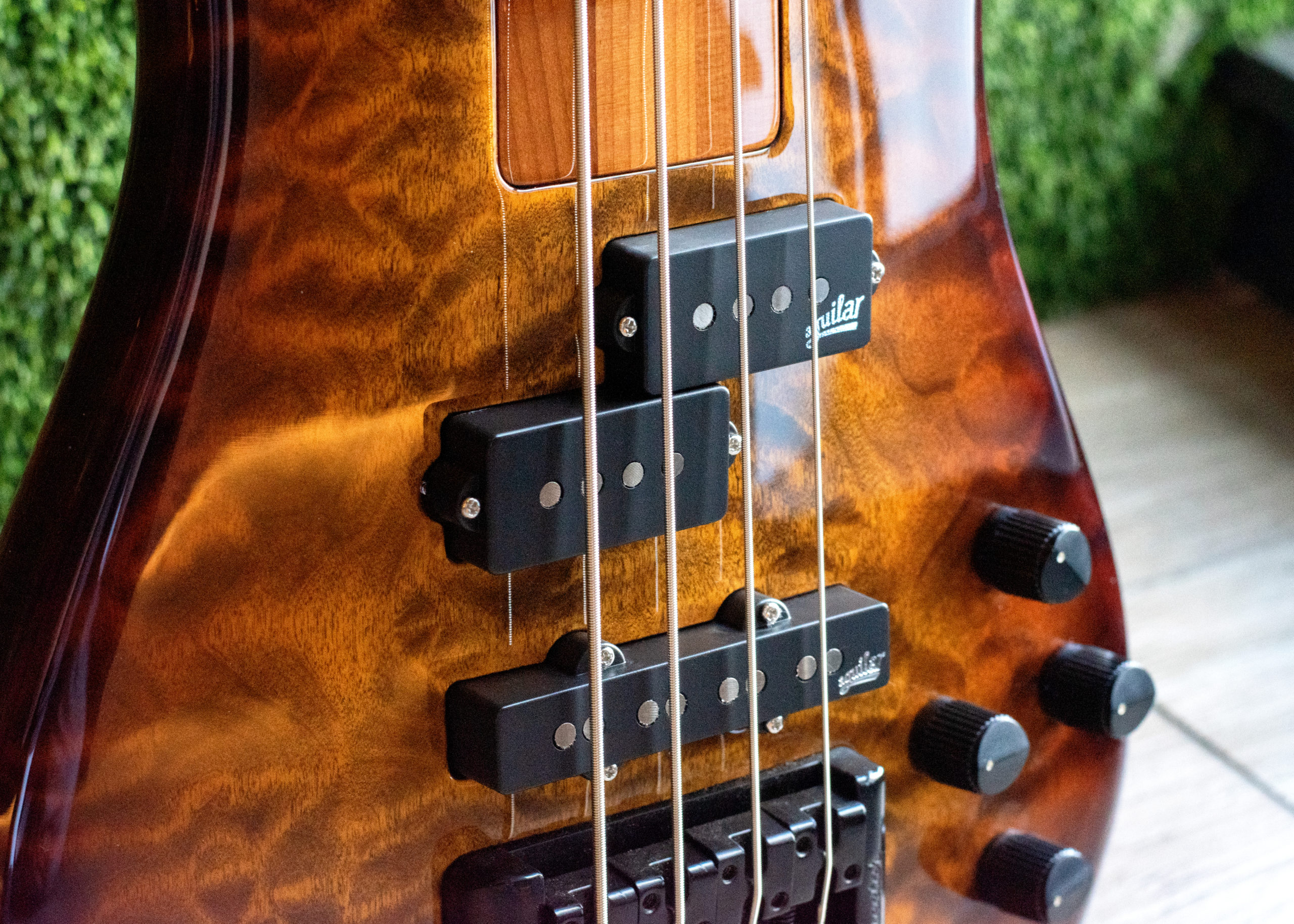 closeup of body of orange burst bass