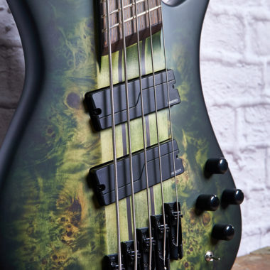 closeup of body of green burst Spector bass