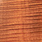 close up of Sienna Stain finish on bass guitar